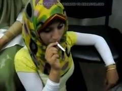 Hot arab hijab girl smoke a cigarette for the first time